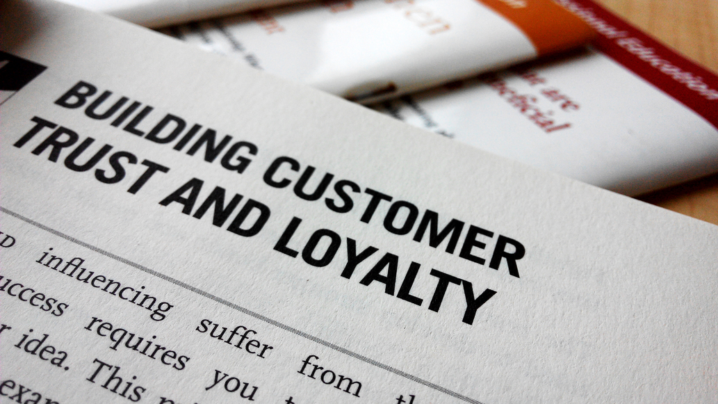 Buiding customer trust and loyalty word on a book